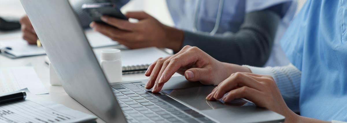 close up of doctors on a laptop